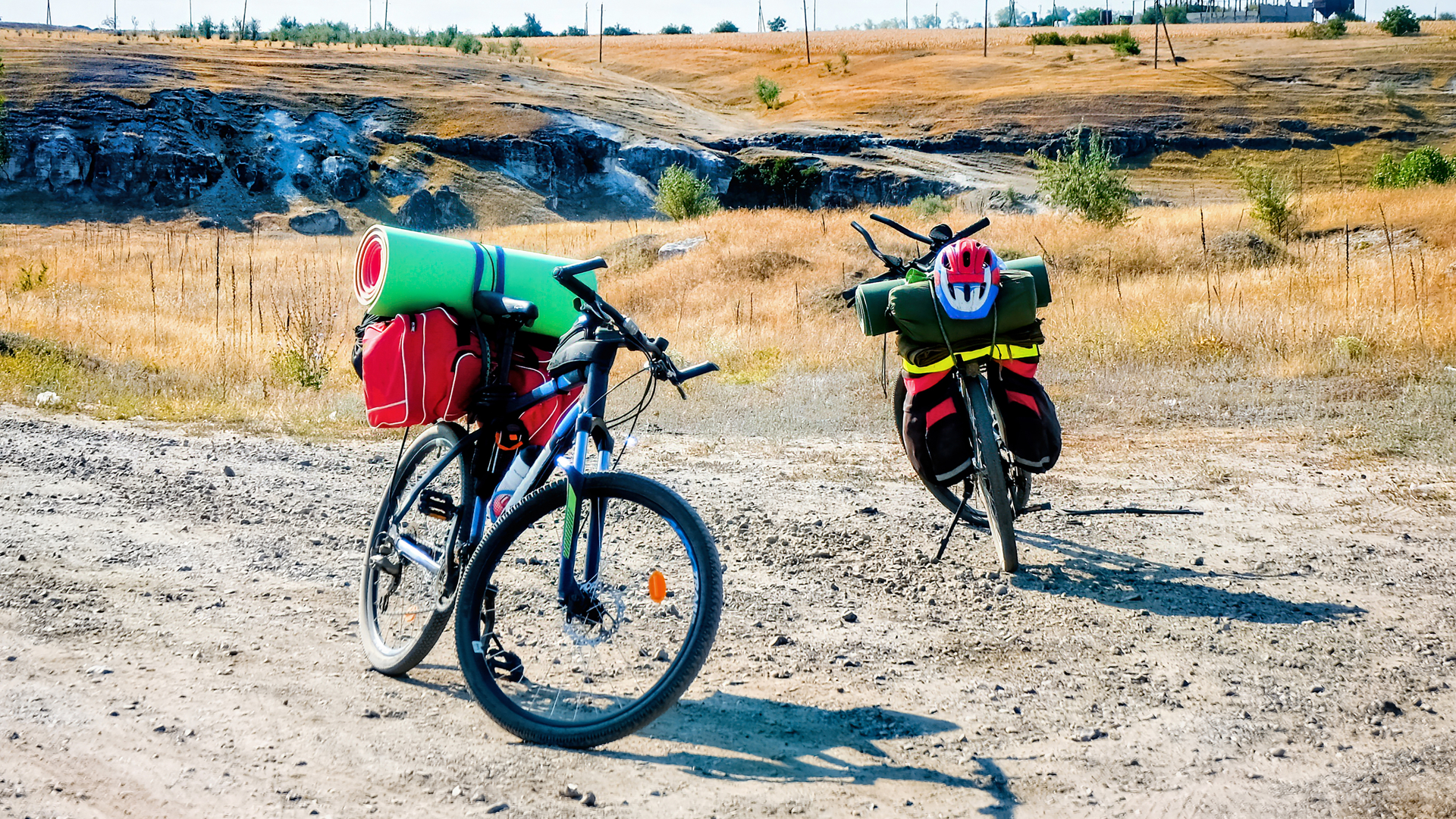 two-parked-bicycles-with-traveler-s-stuff-country-road-ravine-fields-moldova